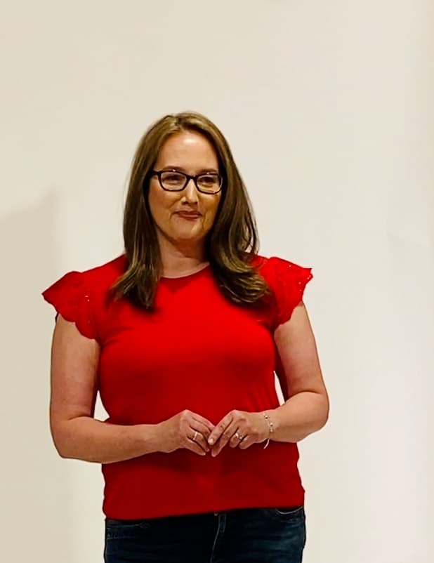 Kimberly King on stage speaking to an audience